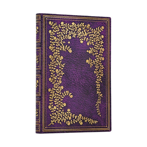 Purple notebook with gold floral design on a white background